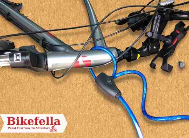 Bike lock securing bicycle frame and wheel.