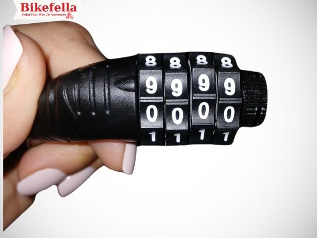 Cable lock held in one hand close-up