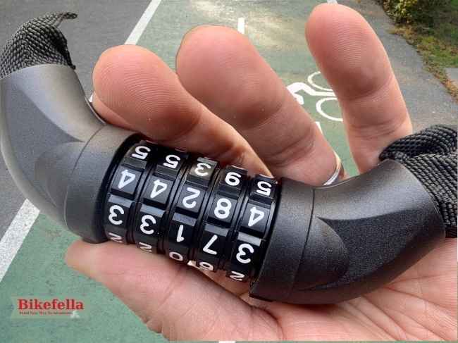 NDakter bike lock held between two fingers