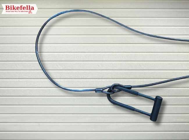 Titanker lock securing bike frame to outdoor bike rack