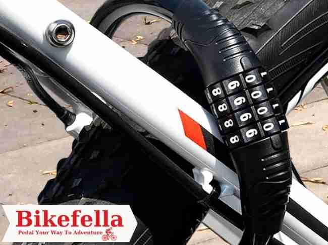 Close-up of combination lock coiled around bike frame and tire